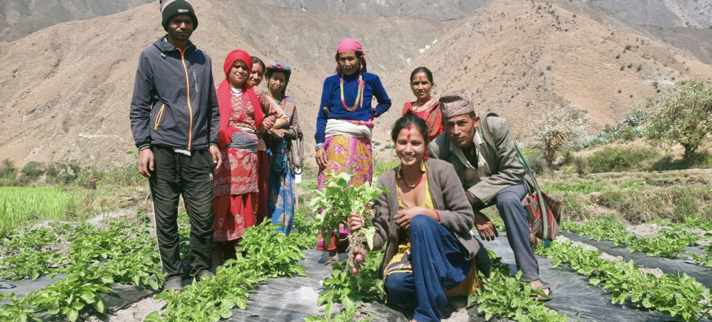 Members of farmers group happy to the potatoes prouction